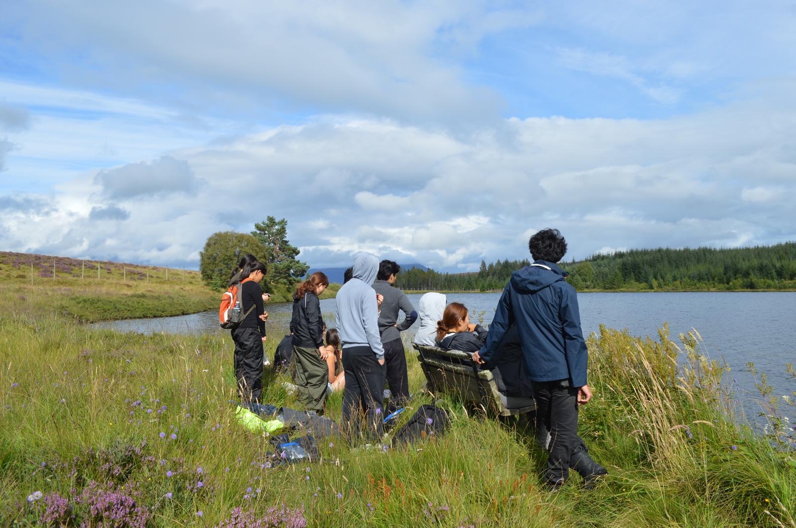 London Student Mission members together beside a lake