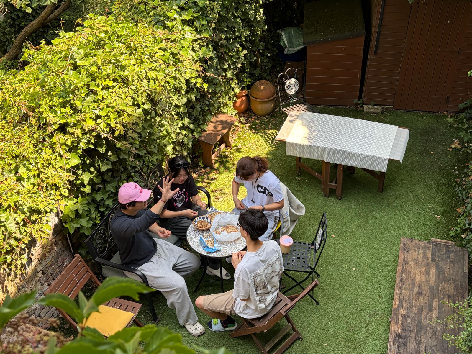 London Student Mission members sharing food in a garden